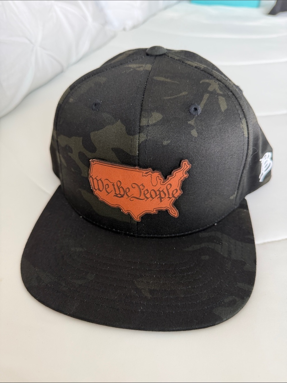 NWOT Black Camo Snapback Hat with Orange 'We the People' Patch